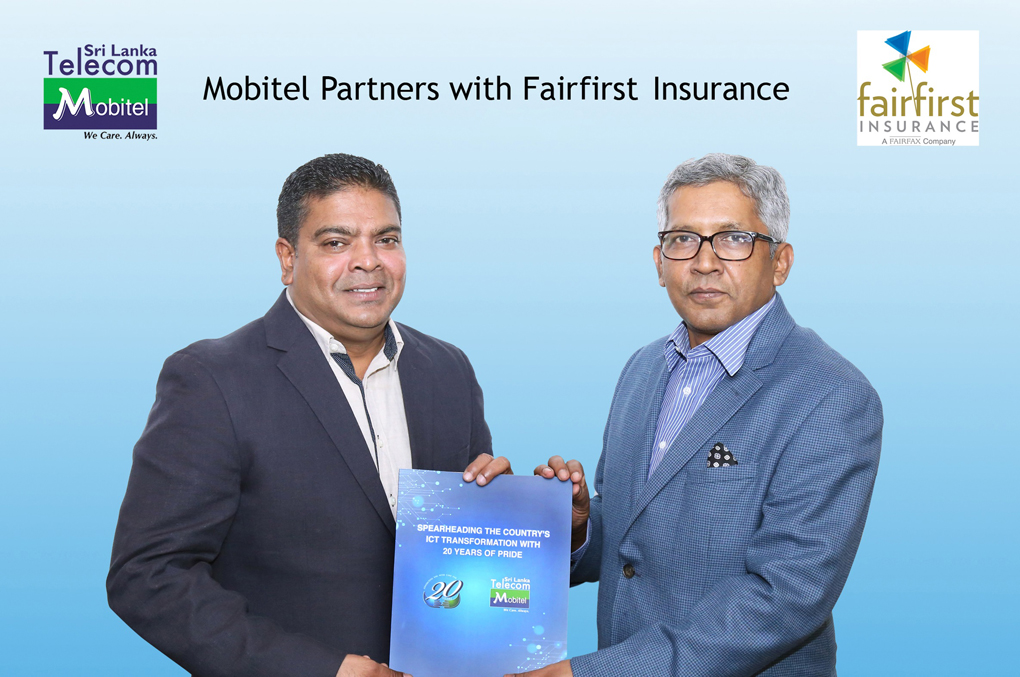 Mobitel Chief Executive Officer Mr. Nalin Perera exchanging the partnership agreement with Fairfirst Managing Director and Chief Executive Officer Dr. Sanjeev Jha.