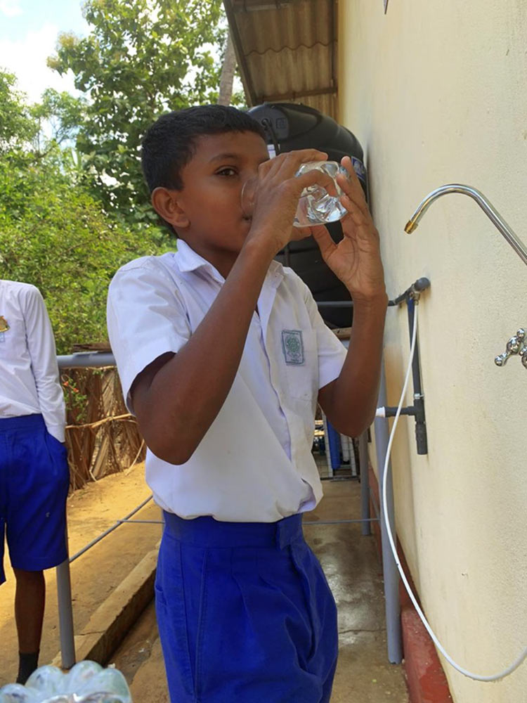 1--A-child-from-Pottuvilluwa-Vidyalaya-drinking-the-safe-and-clean-water-after-the-official-opening-of-the-RO-water-treatment-plant 1--A-child-from-Pottuvilluwa-Vidyalaya-drinking-the-safe-and-clean-water-after-the-official-opening-of-the-RO-water-treatment-plant