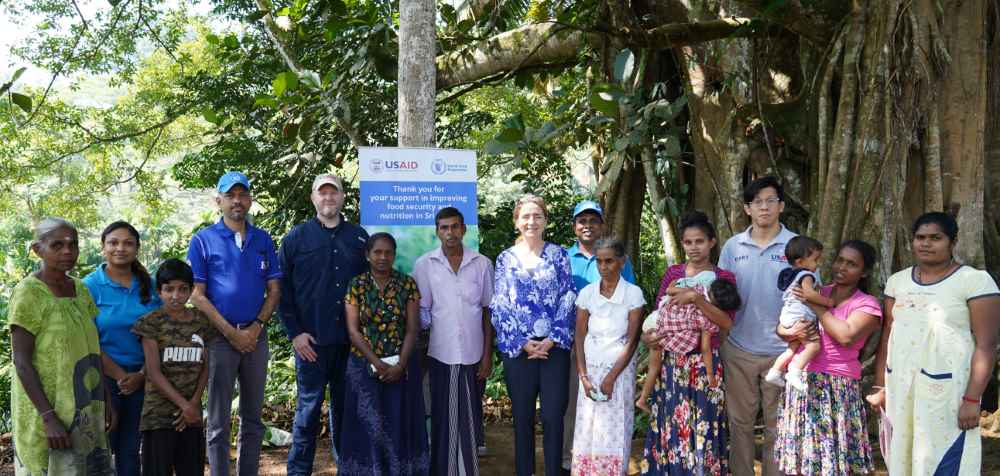 Director for Asia, Latin America, and the Caribbean of USAID's BHA with a group of people in Rathnapura (LBN)
