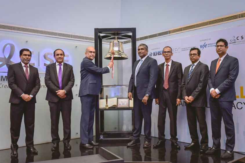 Podium-Participants-Ring-the-bell-for-financial-literacy-LBN.jpg